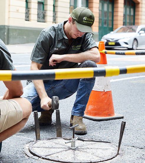 The Relining Company staff fixing a city sewer