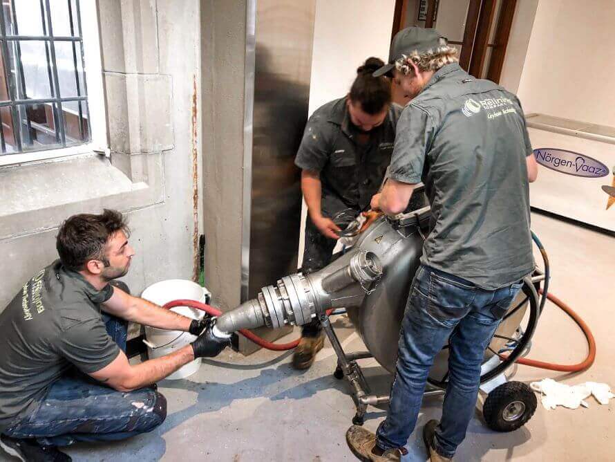 The Relining Company employees using a robotic pipe tool