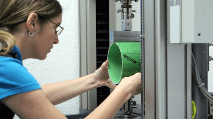 Woman installing a new pipe