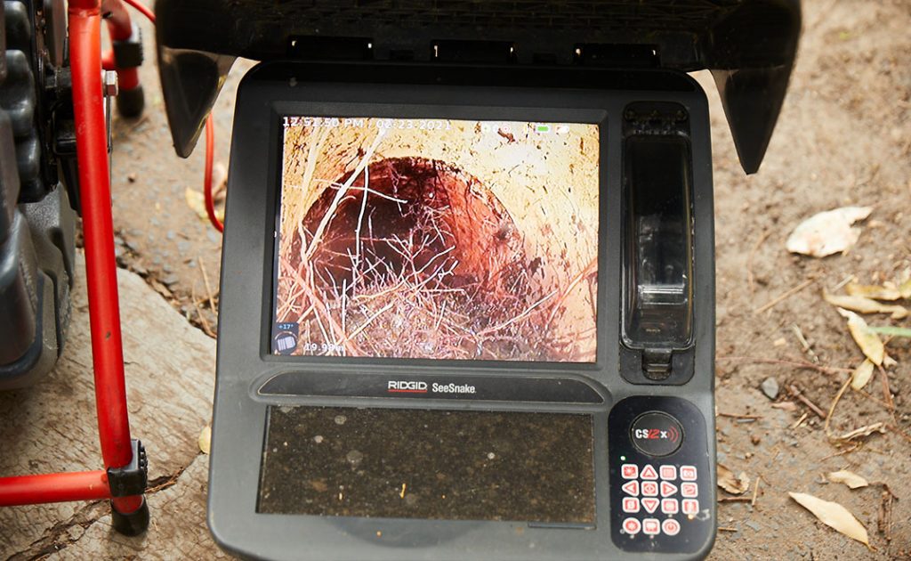 A drain camera inspecting the inside of a pipe