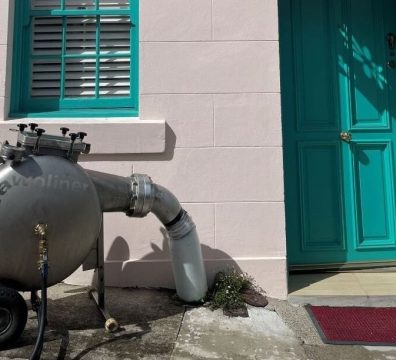 A robotic pipe relining tool outside of a house