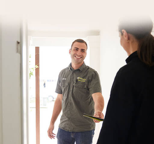 Pipe Relining Employee Helping Woman in her House