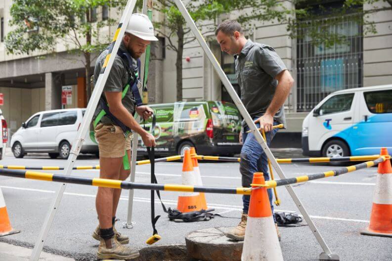 Two sydney drain professionals looking at sewer