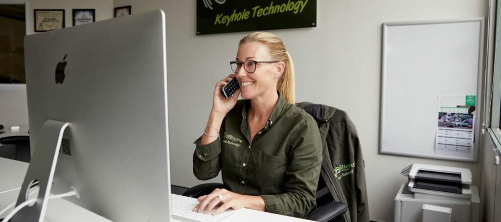 Smiling blond woman on phone