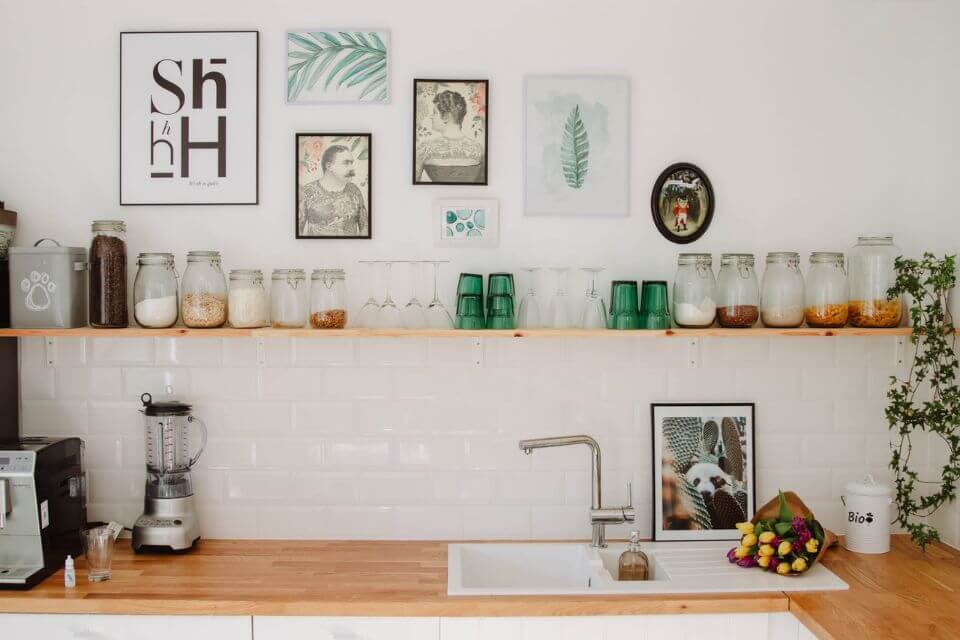 A kitchen sink surrounded by wooden counter