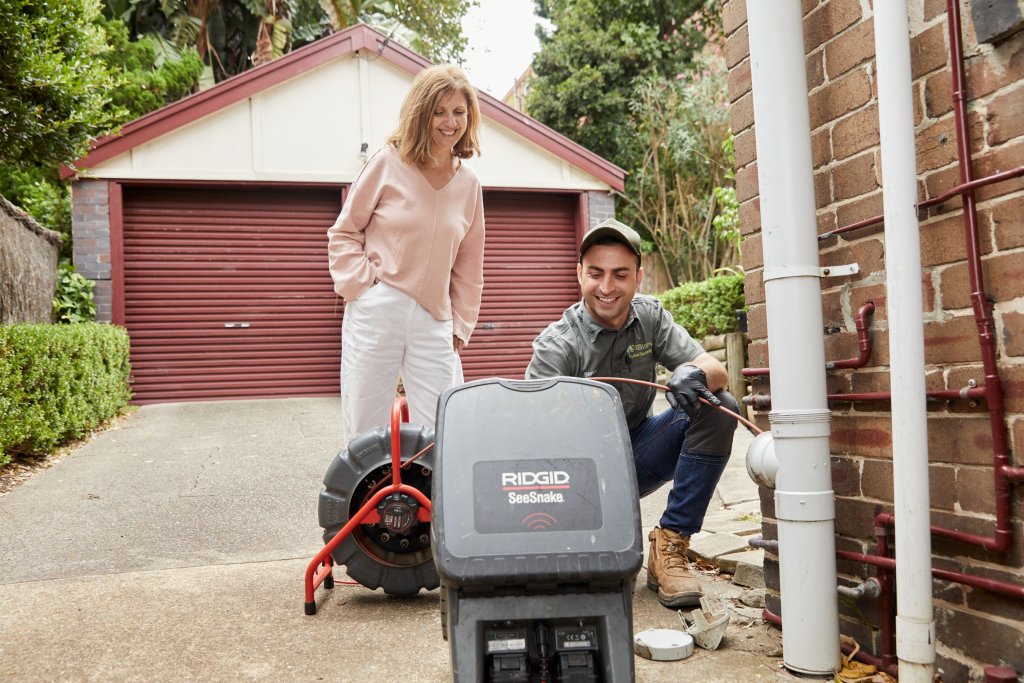 A pipe relining expert helping a sydney home