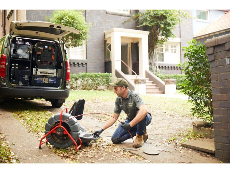 Pipe relining expert preparing to reline residential pipe