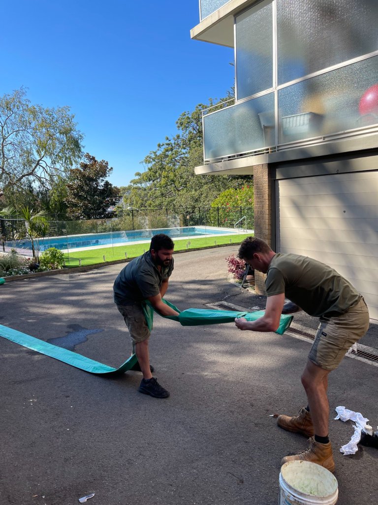 Professional Pipe Relining Team working on a residential site.