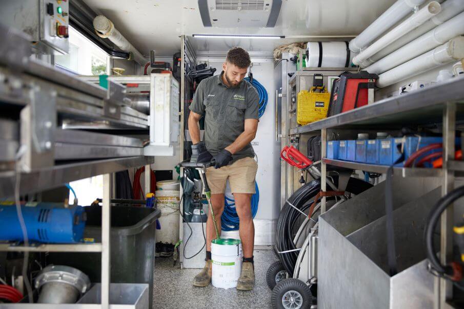 Tradesman preparing for pipe relining