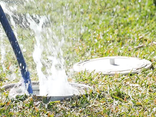 Water splashing out of sewer drain