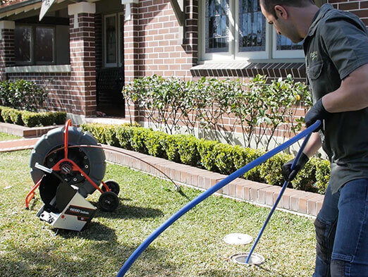 A man performing pipe relining